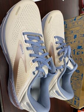 Brooks Lace-Up Sneaker in rose gold color and light grey.  Never worn